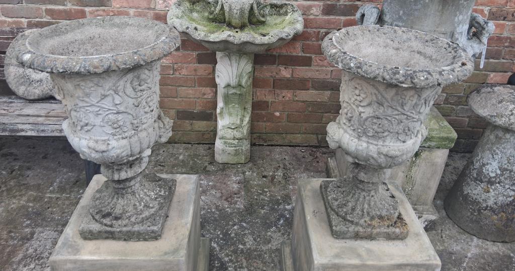 <p>Pair of Cast weathered Urns</p><p>60 cm high 70 cm wide</p><p><br></p>